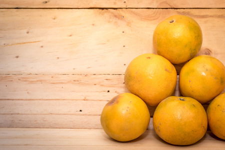 tangerine orange on wood