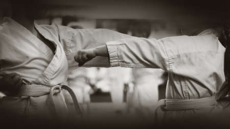 Kids training on karate-do. Black and white. Photo without faces.の写真素材