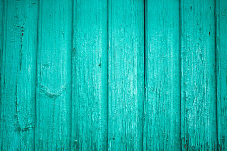 The beautiful surface of old vertical planks of turquoise bright color. Vintage rustic background. Eco background.の写真素材