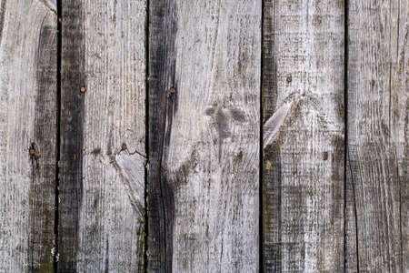 A beautiful surface made of old vertical planks of gray weathered color. Vintage rustic background.