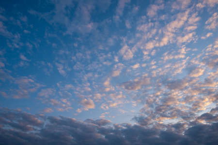 Evening blue sky with dark gray cumulus clouds. replacement texture.の写真素材