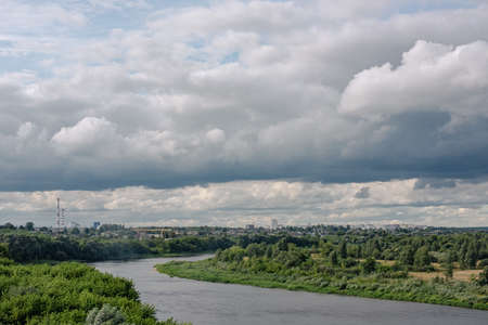 Beautiful dramatic view of the river and the industrial city.