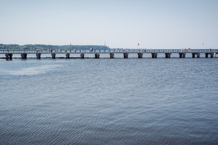 A long bridge in the sea from the pier to the shore in the Gulf of Finland.の写真素材