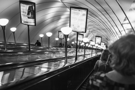 Russia, St. Petersburg - August 19, 2022. People go down the escalator in the st. Petersburg metro.