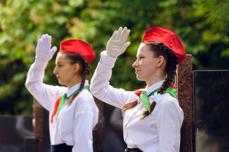 Bobruisk, Belarus - May 25, 2023. Teenage girls in elegant pioneer uniforms at a gala event.のeditorial素材
