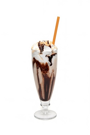 Hot chocolate with syrup in glass cupの写真素材