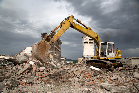  Bulldozer removes the debris from demolition of old derelict buildingsの写真素材