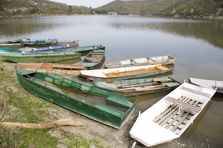 Old Abandoned Boats Stranded On The Shore Of The Lakeの写真素材