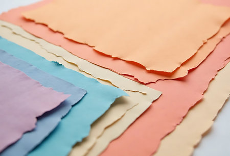 Pieces of torn paper, ready for your message. Shallow depth of field.の写真素材