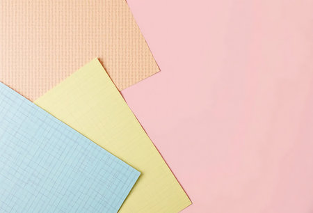 Colored paper for notes on a pink background. Place for text.の写真素材