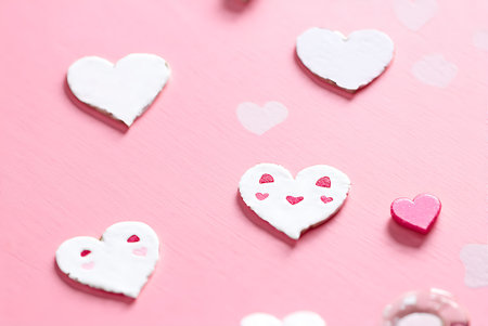 Valentine's Day background. Heart shaped cookies on pink background