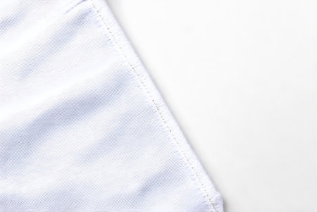 close up of a white fabric texture on white background with copy space