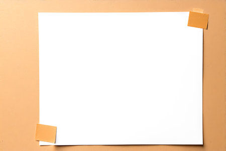 Blank sheet of paper with adhesive tape on a brown background.
