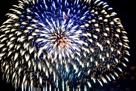 Colorful fireworks of various colors over night sky. Abstract background.