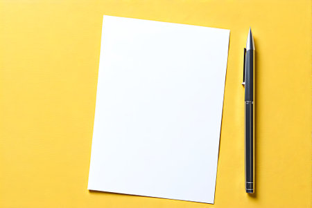 Blank paper and pen on yellow background. Mockup for design