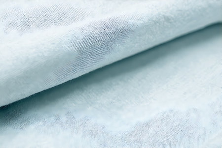 Close up of white fabric cloth texture for background. Soft focus.