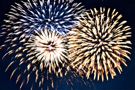 Colorful fireworks of various colors over night sky background, celebration conceptの写真素材