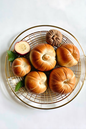 Baked buns with apple and walnut on a white background