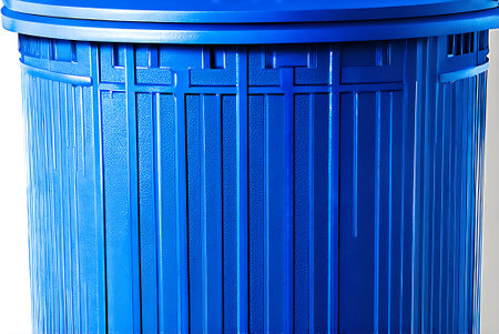 Blue plastic trash can on a white background. Close-up.の写真素材