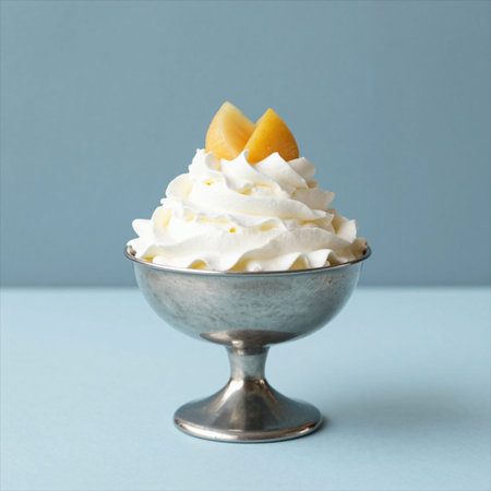 Vanilla ice cream with peach in a vase on blue background