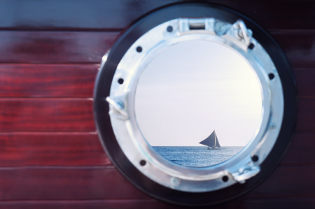 Sunset through the portholes of the boatの写真素材