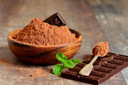 Cocoa powder in a wooden bowl.