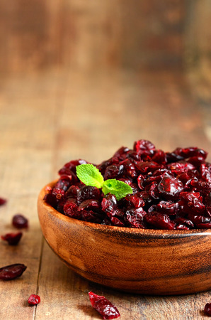 Dried cranberry in a wooden bowl.の写真素材