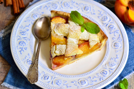 Piece of peach crostata.Rustic style.の写真素材