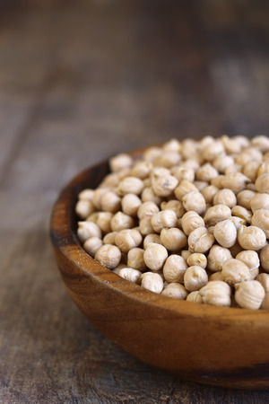 Dry chickpea on a rustic wooden background.の写真素材