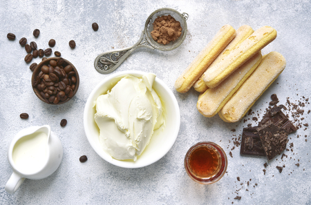Ingredients for making dessert tiramisu on a light slate,stone or concrete background.Top view with copy space.の写真素材