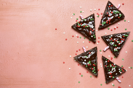Chocolate christmas tree on a rose slate, stone or concrete background.Top view with copy space.の写真素材