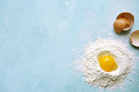 Culinary background with ingredients for making pasta or dumplings on a light blue slate, stone or concrete background.Top view with copy space.の写真素材
