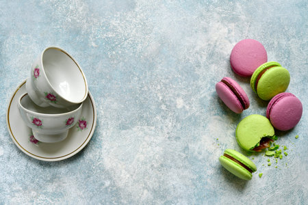 Homemade french almond cookies macarons on a light blue slate, stone or concrete background.Top view with copy space.の写真素材