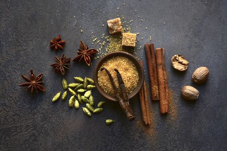 Variety of winter spices on a dark slate, stone or concrete background. Top view with copy space.の写真素材