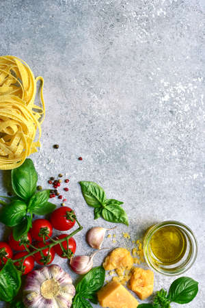 Culinary background with traditional ingredients of mediterranean cuisine on a light gray slate, stone or concrete table. Top view with copy space.の写真素材