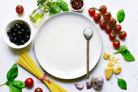 Culinary background with ingredients of italian cuisine on a light slate, stone or concrete background. Top view with copy space.の写真素材
