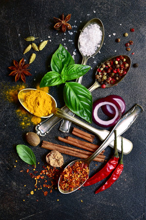 Set of natural organic asian spices on a dark slate, stone or concrete background. Top view with copy space.の写真素材
