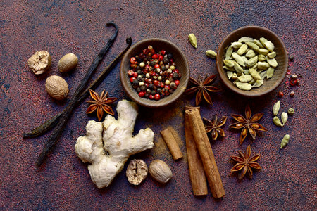 Variety of winter spices on a dark slate, stone or concrete background. Top view with copy space.の写真素材