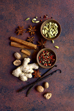 Variety of winter spices on a dark slate, stone or concrete background. Top view with copy space.の写真素材