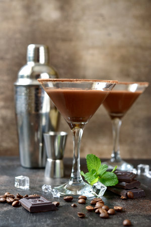 Delicious chocolate coffee martini with mint in a glasses on a dark slate, stone or concrete background.の写真素材
