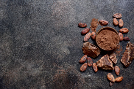 Ingredients for making homemade chocolate on a dark slate, stone or concrete table. Top view with copy space.の写真素材