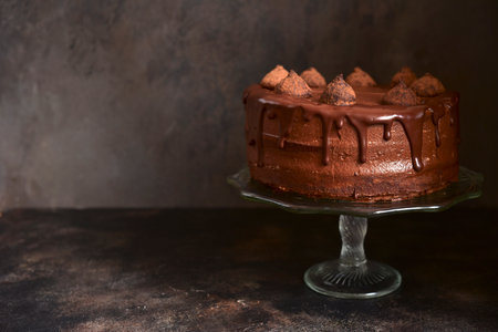 Homemade delicious chocolate cake "Truffel" on a dark slate, stone or concrete backgroundの写真素材