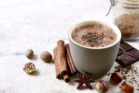 Delicious spicy hot chocolate in a mug on a light slate, stone or concrete background.の写真素材