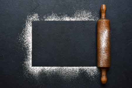 Food background with ingredients for baking on a black slate, stone or concrete table. Top view with copy space.の写真素材