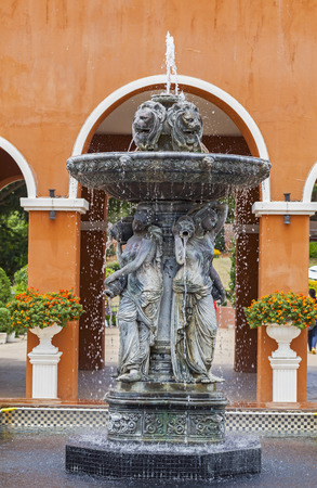 The female and lion head of fountain in the garden in Italy or Rome styleの写真素材