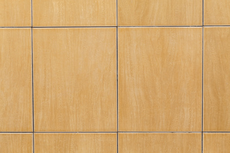 Orange tiles wall in toilet, background or textureの写真素材