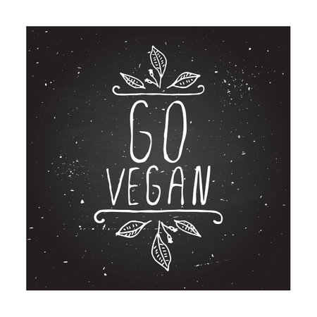 Hand-sketched typographic element. Go vegan - product label on chalkboard. Suitable for ads, signboards, packaging and identity and web designs.のイラスト素材