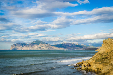 Beautiful view of the sea, sky and mountainsの写真素材
