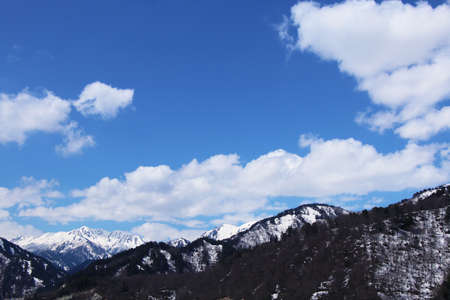 Snow mountain with blue sky in japanの写真素材