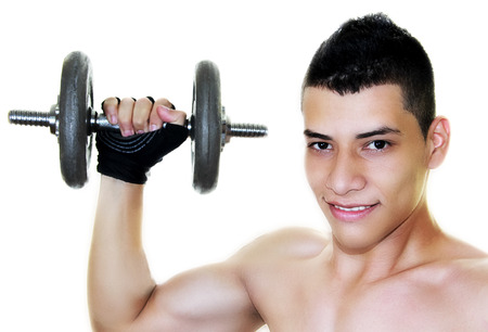 young and handsome man working out at gymの写真素材